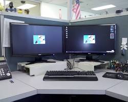 Image of Call center agent working with multiple screens