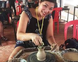 Image of Tourists participating in a pottery workshop in Cambodia