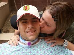 Rene Sochia gives her son Pfc. Matt Leyva a kiss on the cheek during a recent visit to Brooke Army Medical Center in San Antonio. - size0