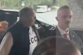 Russia’s foreign minister dons USSR jumper as he arrives at Trump-Putin summit