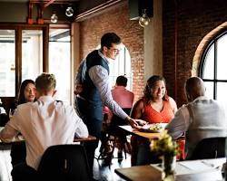 Image of Restaurant busboy working