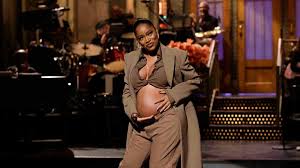 Keke Palmer reveals baby bump as part of her 'Saturday Night Live' opening 
monologue