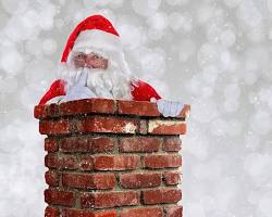 صورة بابا نويل ينزل من المدخنة