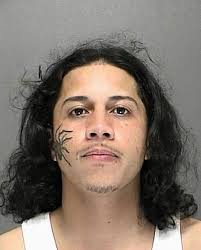 Eric Ortiz: Man with spider tattoo wanted by police (Picture: Volusia County Sheriff&#39;s Office). Here&#39;s one suspect who is unlikely to stay hidden from ... - b1