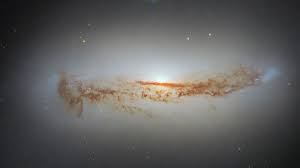 New Hubble photo shows galaxy's bright supermassive black hole ...