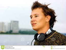 DJ Roman Kravtsov touching his headphones and standing. MR: YES; PR: NO - dj-graffiti-6917100