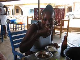 Image result for picture of flavor the nigerian musician eating local food