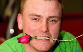 James Miller, 20, stripped down to a pair of white boxer shorts and ran across the pitch at Blackburn Rovers&#39; Ewood Park firing a dozen red roses from a bow ... - JamesMiller_1351212c
