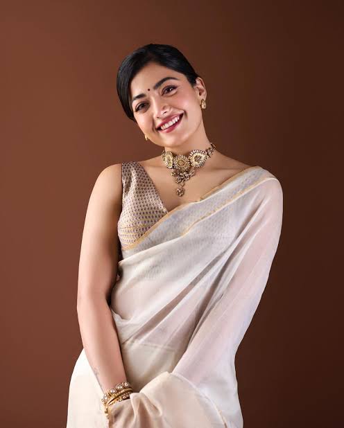 Rashmika Mandanna in a lightweight Raw Mango ivory sari is proof that less  is more | Vogue India | Wedding Wardrobe
