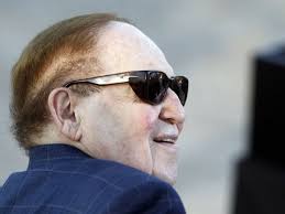 In this July 29, 2012 file photo, CEO of Las Vegas Sands Corp. Sheldon Adelson is seated before former Massachusetts Gov. Mitt Romney delivers a speech in ... - ap-spain-eurovegas-4_3
