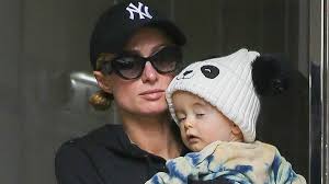 Paris Hilton cradles adorable baby son Phoenix, 9 months, as she steps out in NYC with ...
