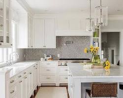 Light gray backsplash in white kitchen