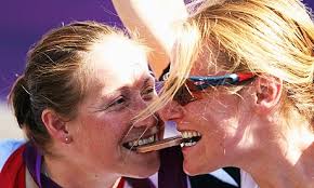 Rachel Morris, left, bites on her bronze medal with Karen Darke following the women&#39;s individual H1-3 road race at Brands Hatch. - Rachel-Morris-left-bites--008