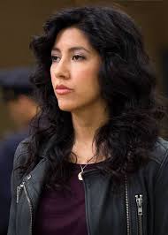 Stephanie Beatriz plays Detective &#39;Rosa Diaz&#39;, an aggressive, enigmatic badass who cites RoboCop as her favourite film, because: “It&#39;s got everything I ... - b99-s1-sb01