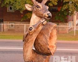 Wood deer sculpture