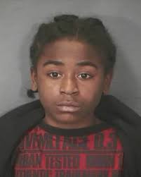... seen here in a police booking shot, was 13 when he participated in a drug-related break-in where his father fatally shot 19-year-old Shayla Johnson. - 10659736-large