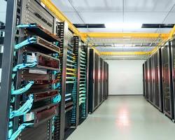 data center with rows of servers and network cables