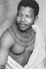 Nelson Mandela in traditional dress in 1950. Photograph: Apic/Getty Images. His birth, into the royal house of the Thembu people, was central to the man. - Nelson-Mandela-in-traditi-001