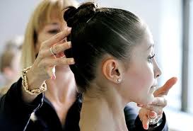Nancy Casciano, 13, of Lilburn, gets the tilt of her head corrected by Katrina Killian, a member of the The School of American Ballet audition faculty ... - slideshow_953303_balletschool.0209e