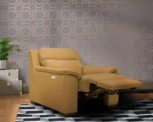 Image of Patterned wallpaper with tan brown sofas