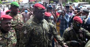 Lieutenant Colonel Mamady Doumbouya, head of the Army special forces and coup leader, waves to the crowd as he arrives at the Palace of the People in Conakry on September 6, 2021