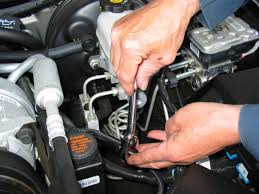 Image result for images of mechanic repairing car