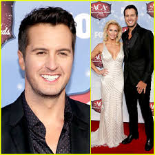 The 37-year-old country singer was joined on the red carpet by his wife Caroline Boyer. - luke-bryan-wins-male-artist-of-the-year-at-acas-2013