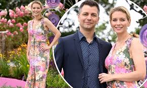 floral gown Rachel Riley stuns in an effortlessly chic floral gown as she joins husband Pasha Kovalev for a stylish outing
