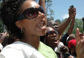 Beaumont residents Crystal Walker, 25, left, and Tonia Francis, 35, chant in protest in front of ... - 628x471