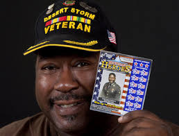 CPM Bobbie James Caviness Jr 01.jpg Cory Morse | The Muskegon ChronicleBobbie James Caviness Jr. displays a lottery ticket with a military photo taken of ... - 9051467-large