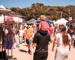 Image of person browsing a farmers' market in Australia