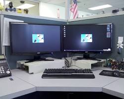 Image of Call center agent working with multiple screens